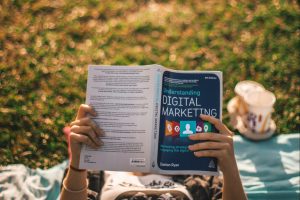 girl-reading-digital-marketing-book